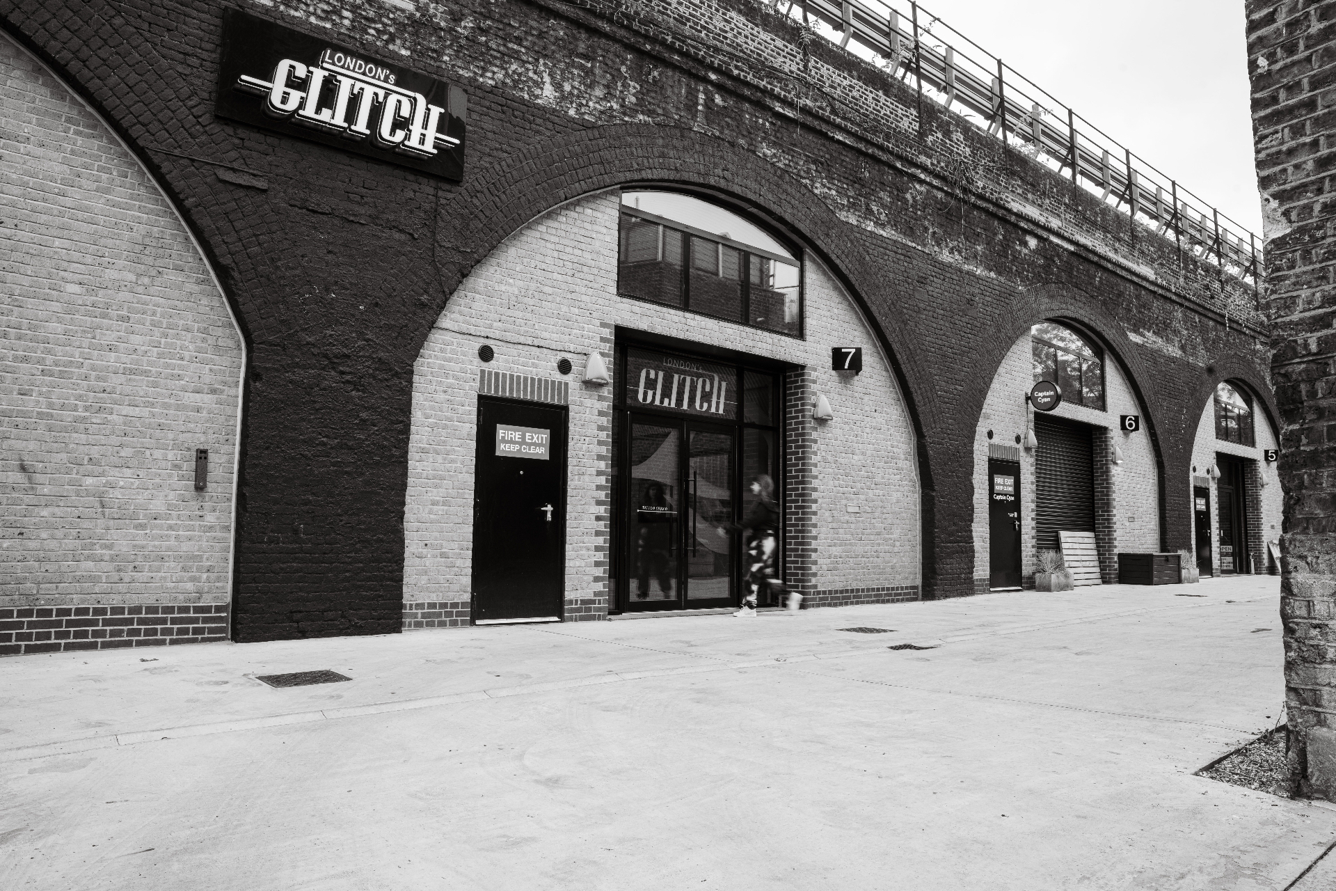 Black and white view of the London's Glitch arches from the street