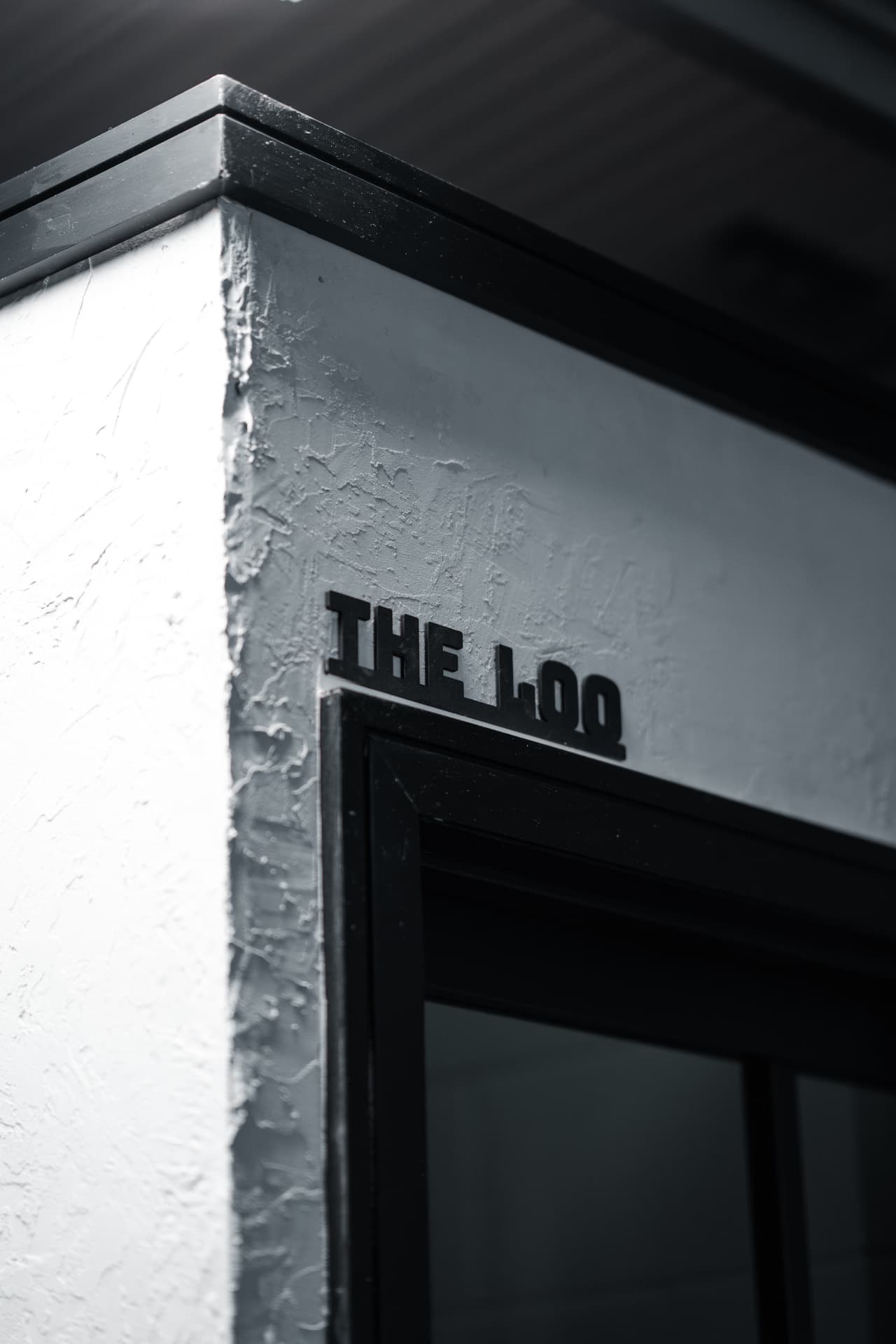 The doorway signed THE LOO inside the studio
