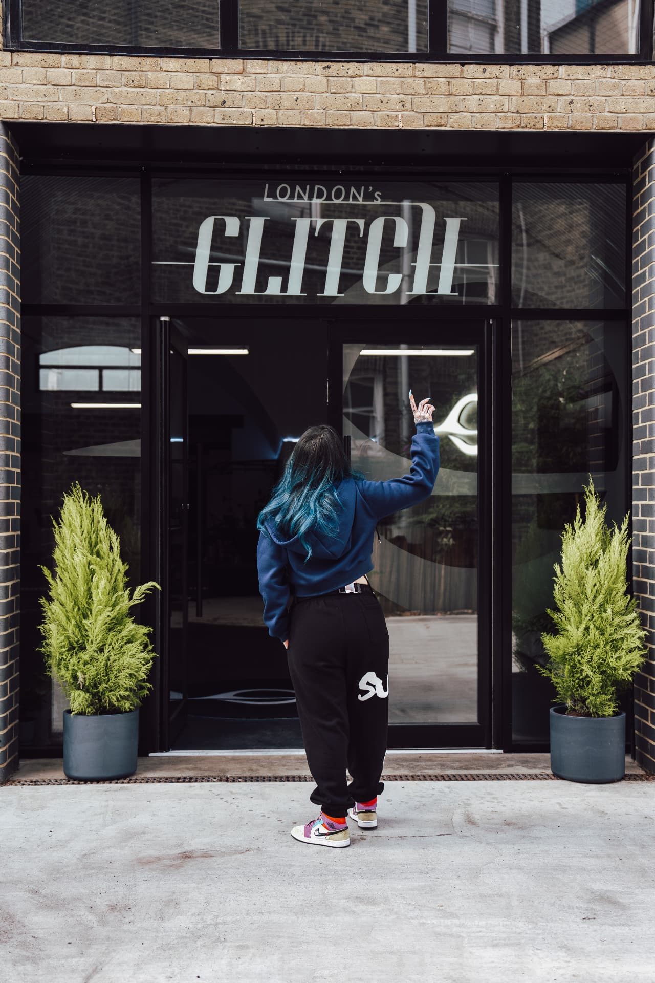 Clara outside the arch on the day the London's Glitch frontage signage went up