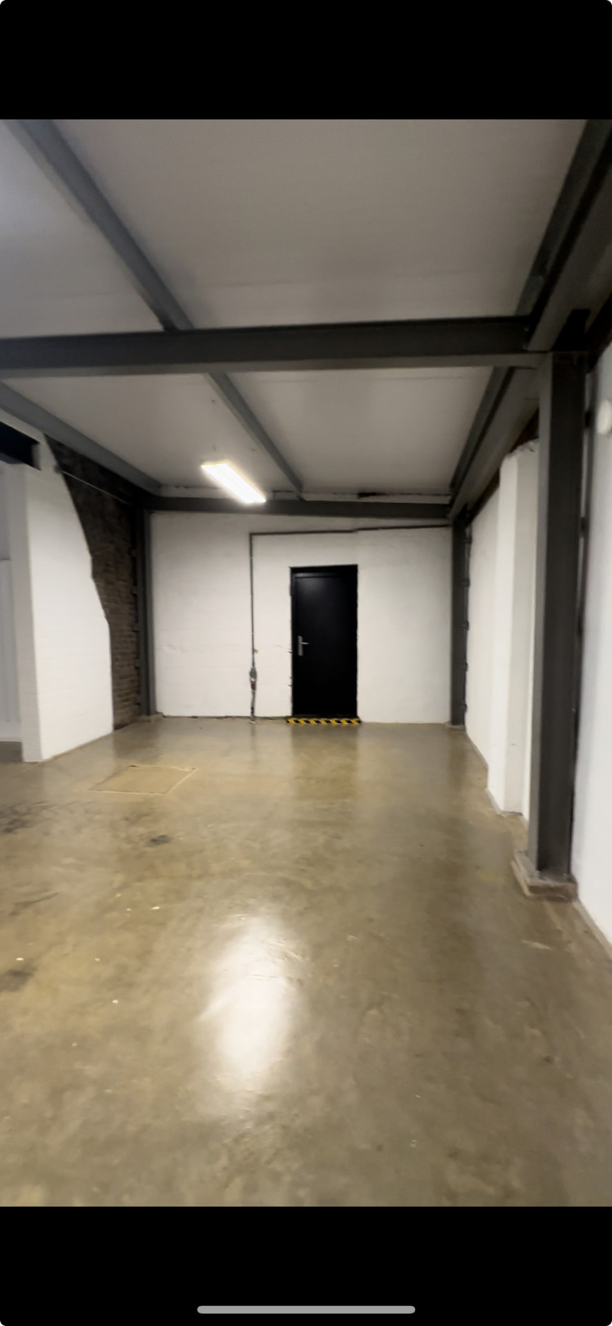 Long empty corridor at the back of the arch before the private station was built