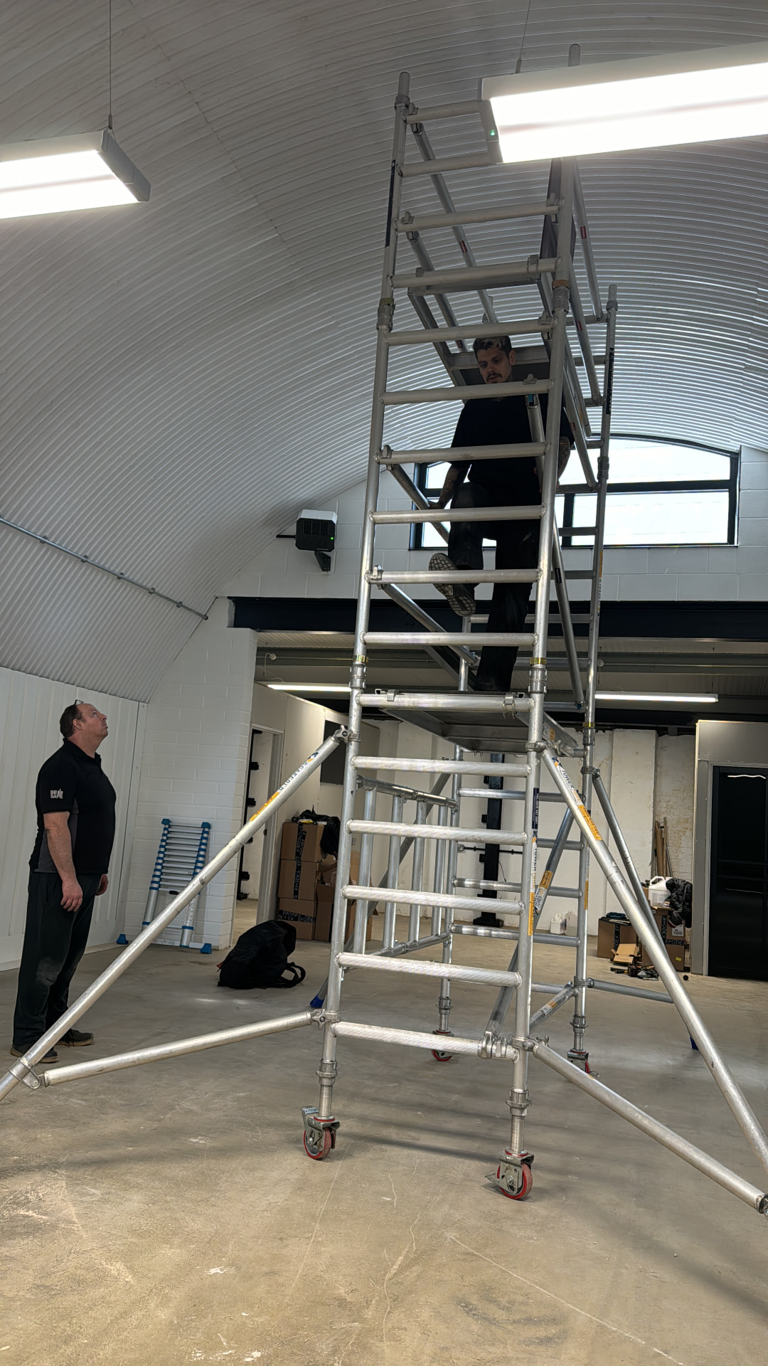 Scaffold tower set up inside the arch to reach the curved ceiling