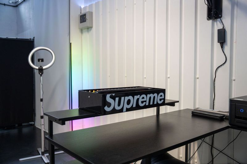 The dedicated private tattoo station lit for a session