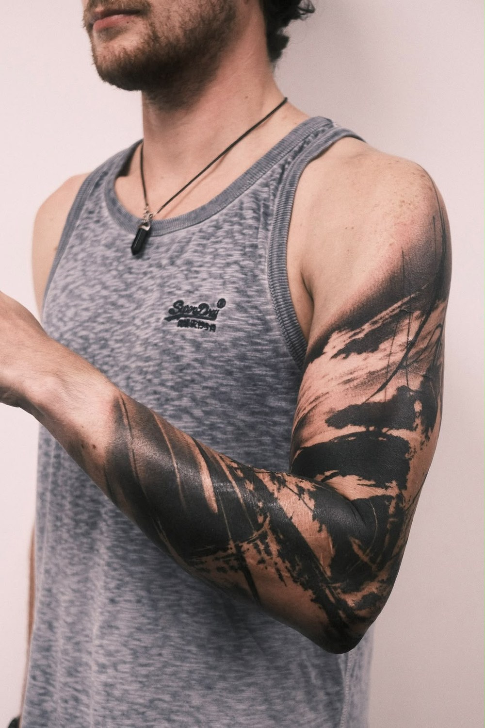 Abstract brushwork blackwork tattoo — London's Glitch